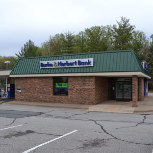 Exterior of Burke &amp; Herbert Bank Burke branch on Old Keene Mill Road, Burke, VA, offering both lobby and drive-up services.