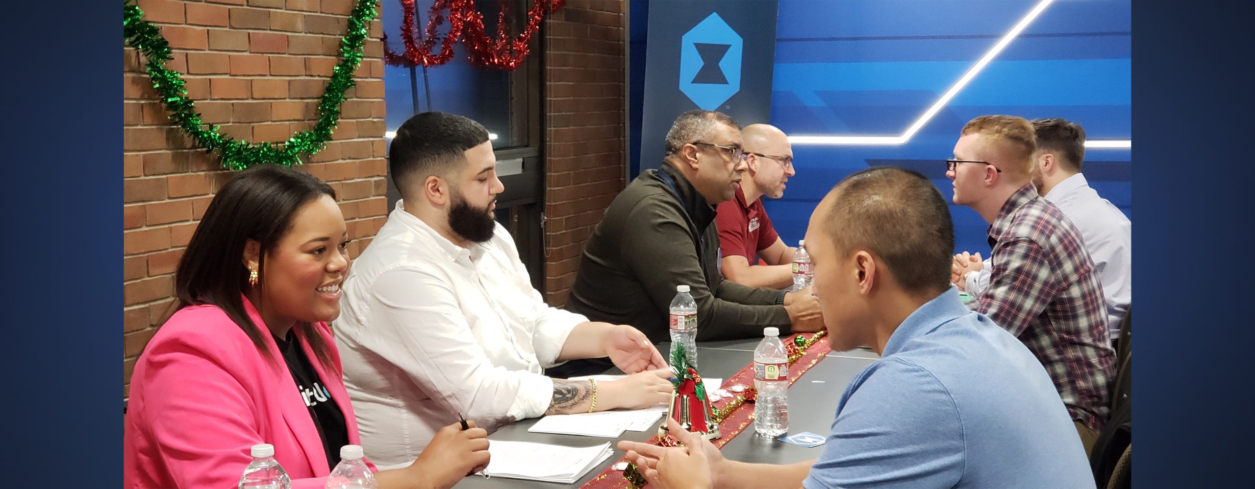Arvest Bank and Forge Institute collaborate to develop cybersecurity career opportunities. Representatives from both organizations are pictured at a joint event, symbolizing their partnership and commitment to fostering talent in the cybersecurity sector.