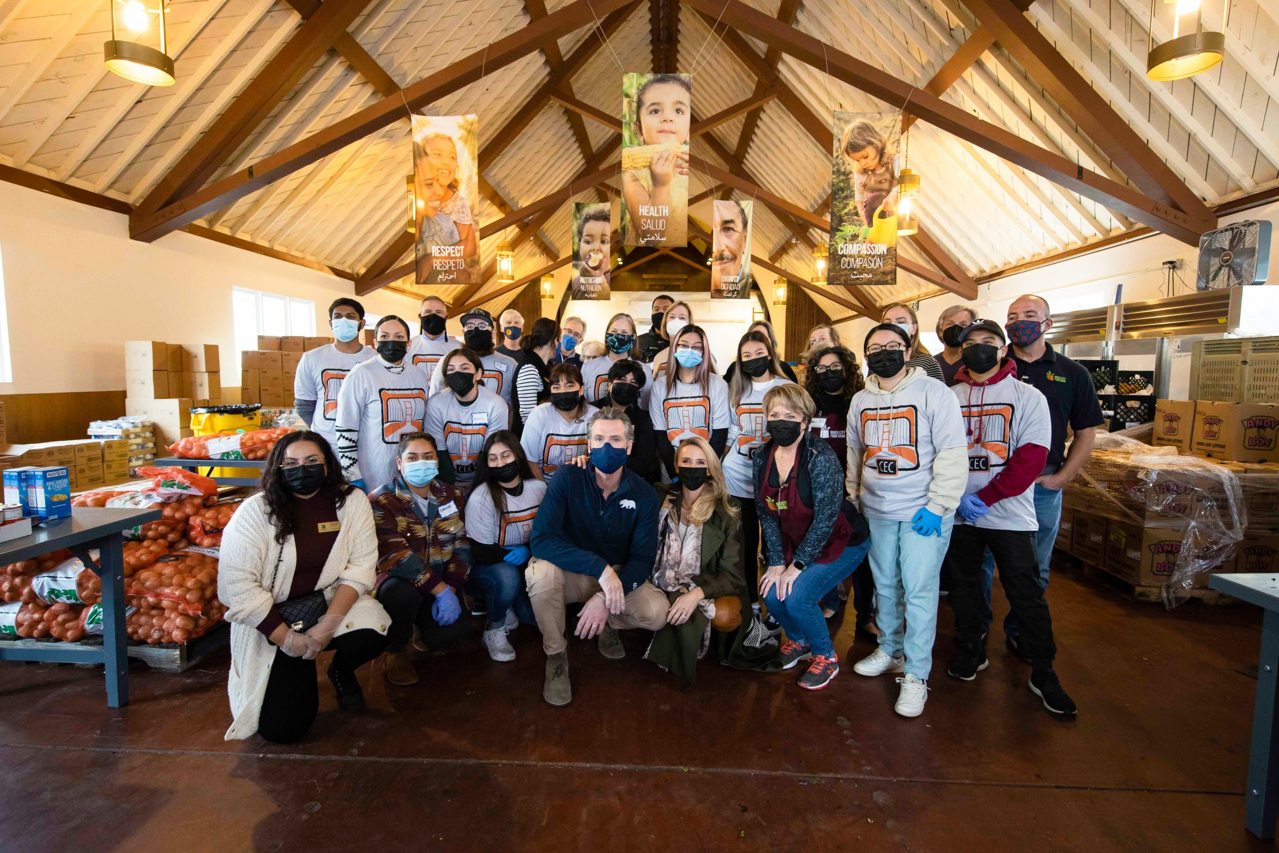 Governor Gavin Newsom and First Partner Jennifer Siebel Newsom Volunteering with Sacramento State Students at River City Food Bank for Thanksgiving Meal Prep