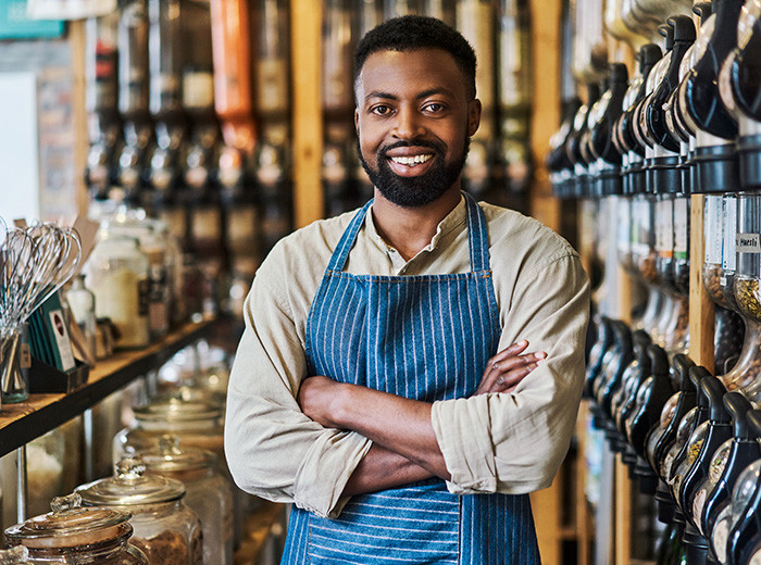 Image of a small business owner discussing loan options with F&amp;M Bank representative