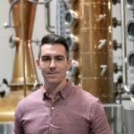 Jordan Helman Co-Founder of High Bank Distillery in Columbus Ohio, showcasing expertise in the craft spirits industry.