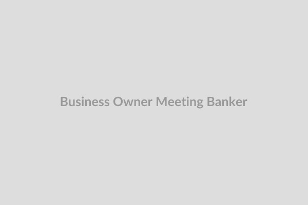 Woman business owner meeting with banker
