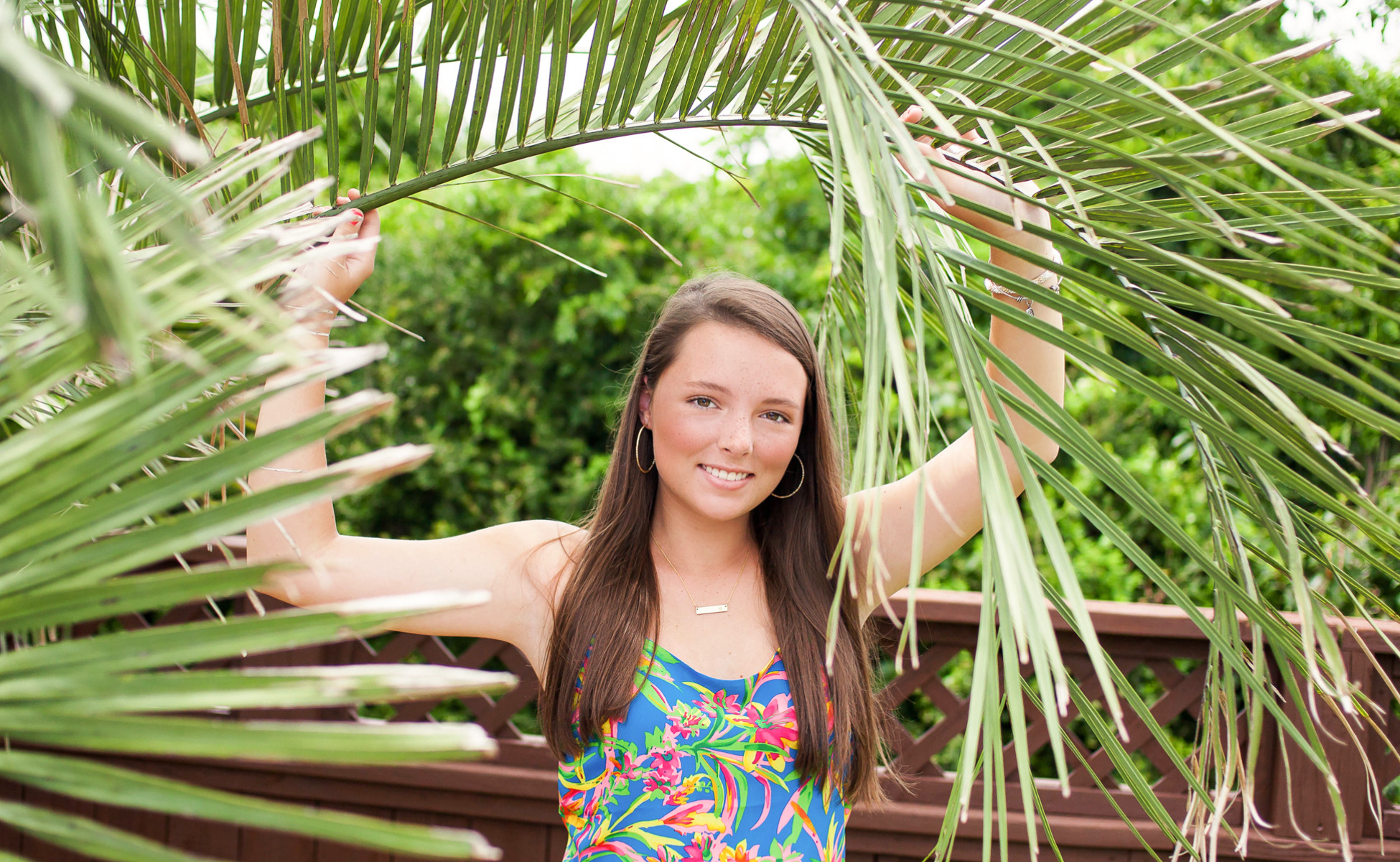 Emily's senior portrait session in Outer Banks, featuring boats at Pirates Cove