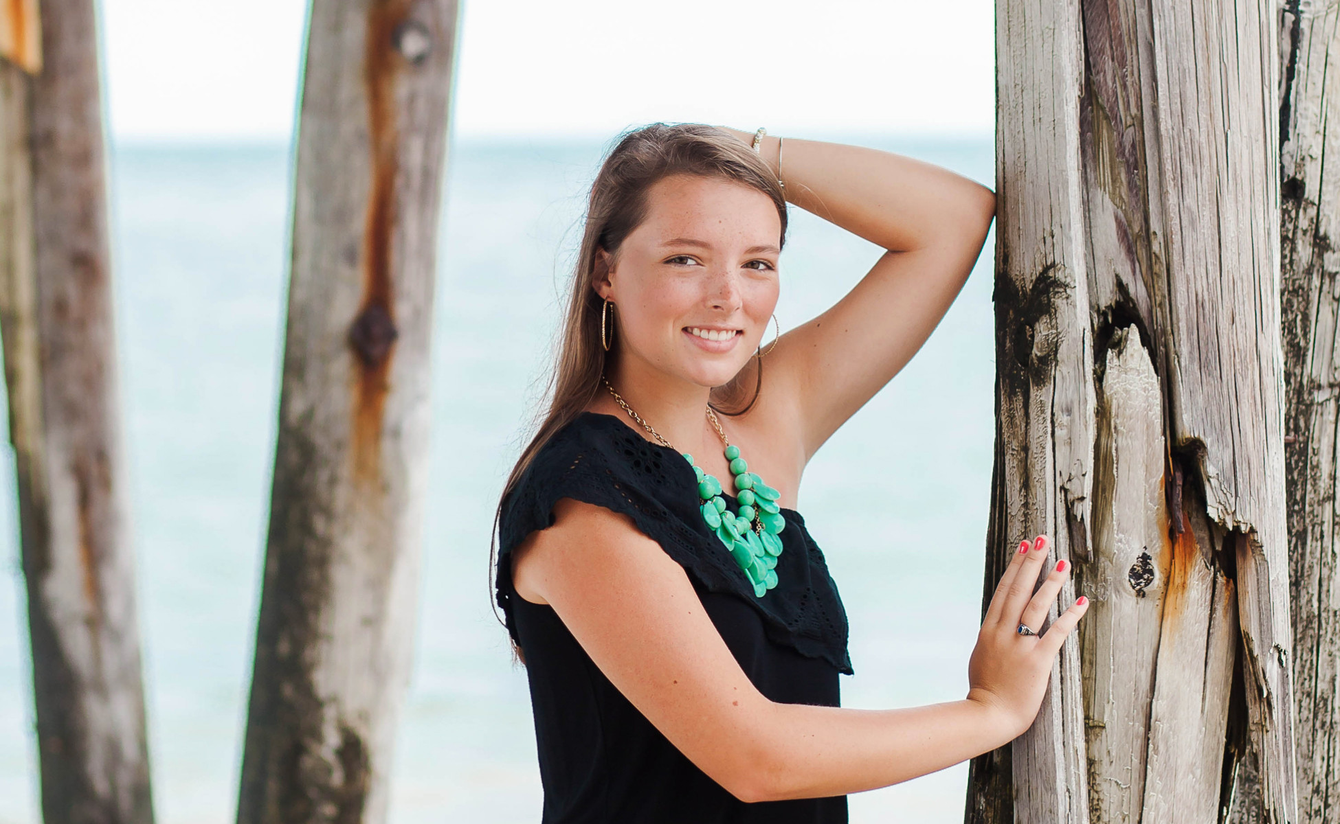 Dramatic senior portrait Outer Banks, Emily posing on the dunes of Jockey Ridge