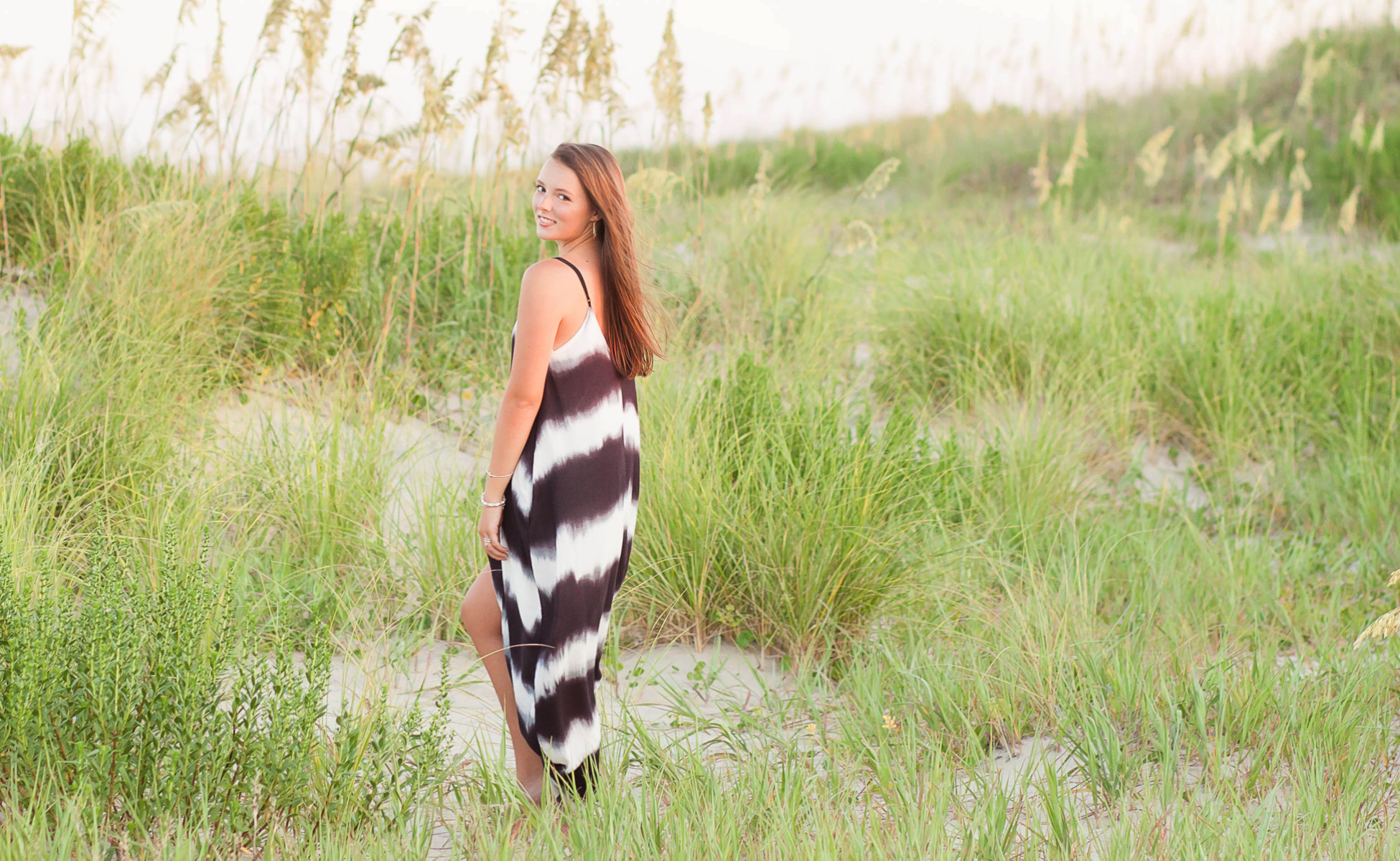 Outer Banks senior portraits, Emily in a relaxed pose with a beautiful backdrop