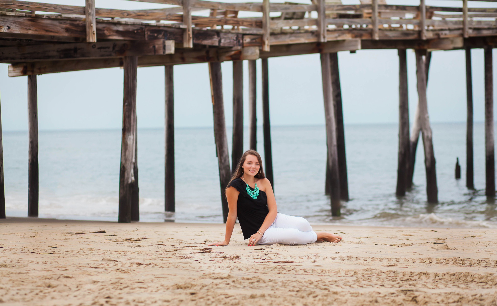 Stunning senior portrait in Outer Banks, Emily against the backdrop of Jockey Ridge dunes