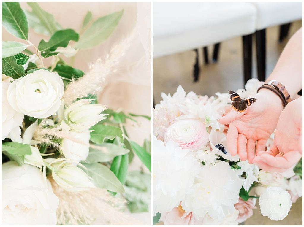 Delicate butterfly resting on hands above the bridal bouquet at Teak Red Bank.