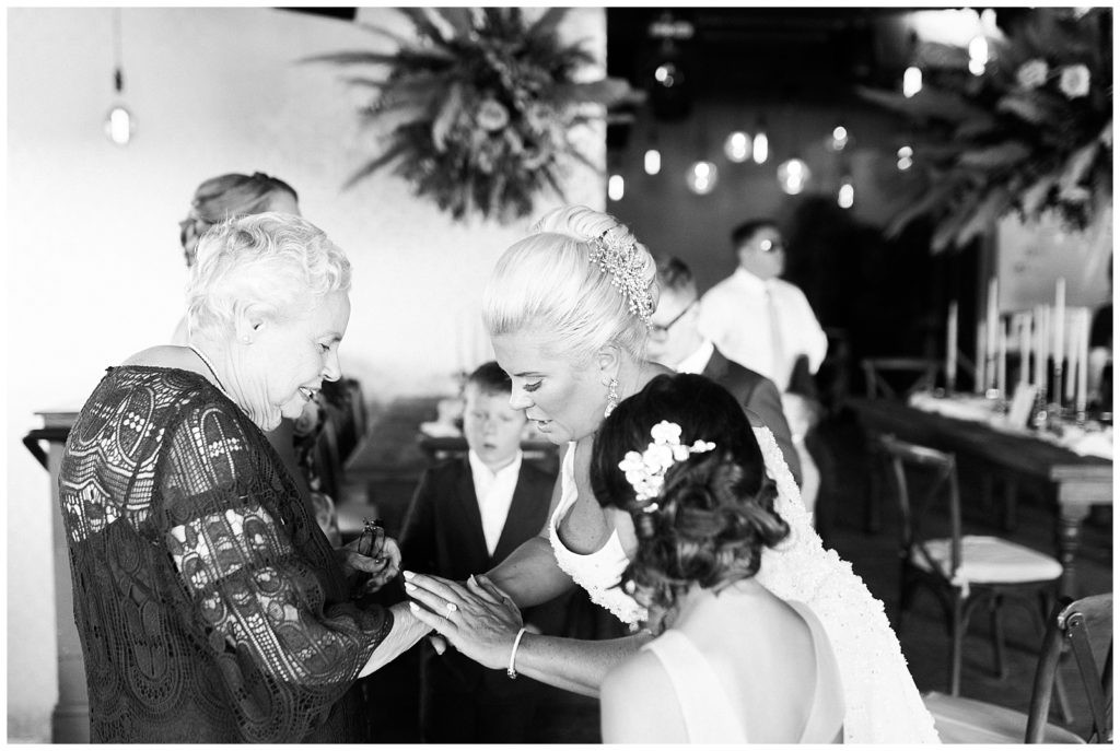 Groom in a light suit at his intimate wedding at Teak Red Bank.