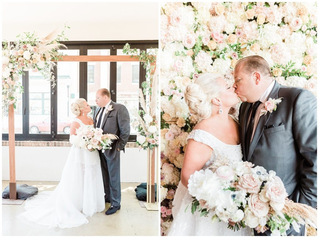 Bride and groom standing under the ceremony arbor at their Teak Red Bank wedding.