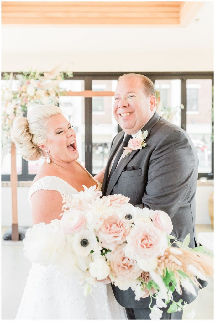 Joyful laughter during the wedding ceremony at Teak Red Bank, NJ.