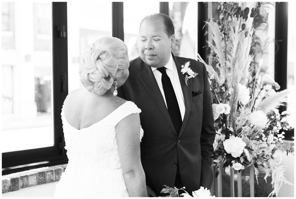 Bride and groom holding hands in their ceremony space at Teak Red Bank, NJ.