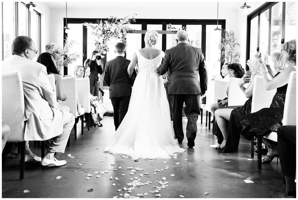 Emotional moment as bride walks down the aisle at Teak Red Bank ceremony.