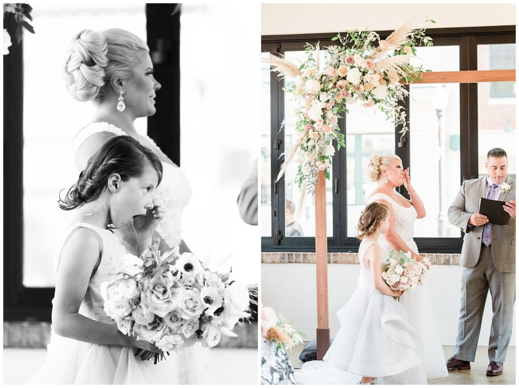 Bride and daughter wiping tears during the heartfelt wedding ceremony at Teak Red Bank.