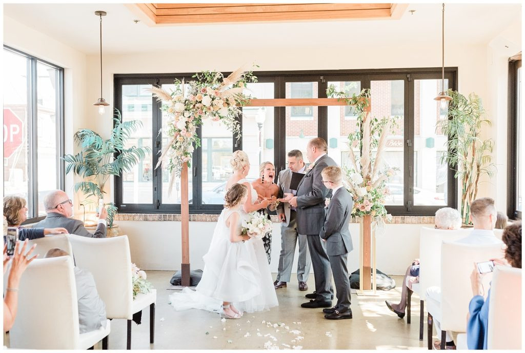 Bride and groom exchanging vows at their wedding ceremony at Teak Red Bank, NJ.