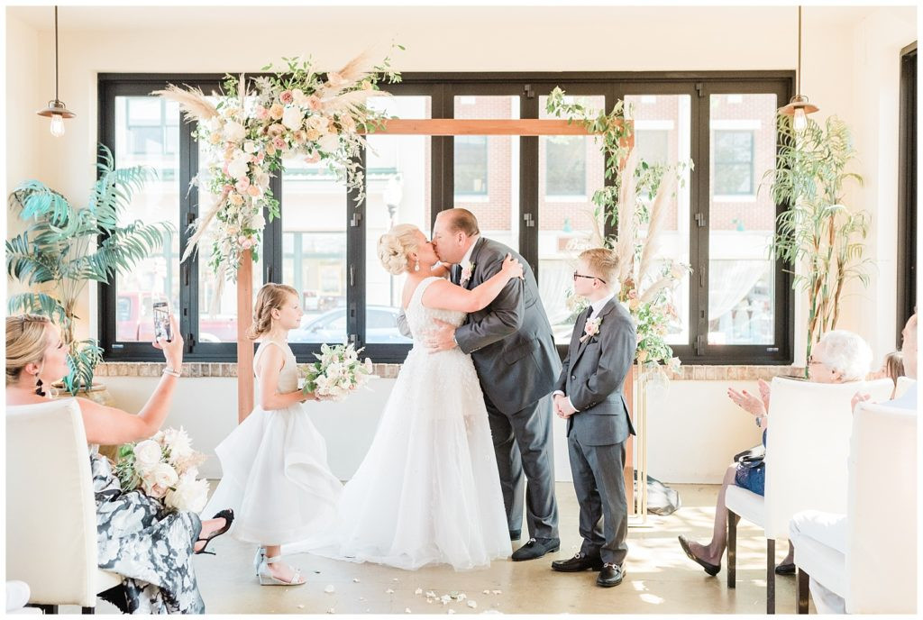 Bride and groom's first kiss as husband and wife at their Teak Red Bank wedding.