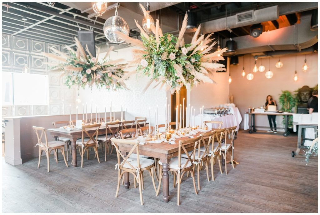 Hanging floral centerpieces above reception tables at Teak Rooftop, Red Bank, NJ.