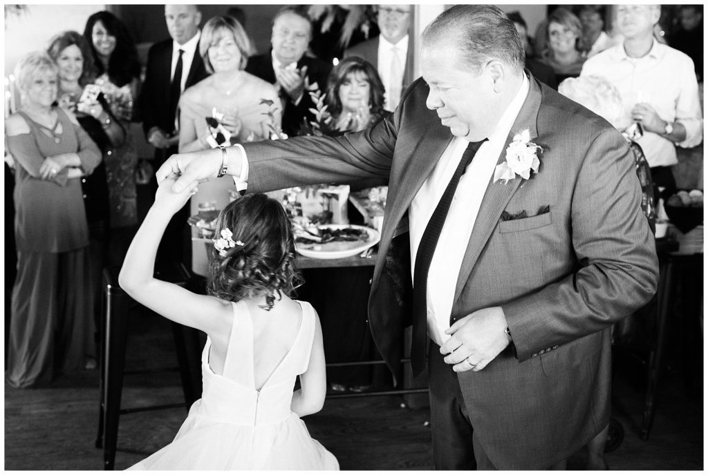 Groom twirling his daughter on the dance floor at Teak Red Bank wedding reception.