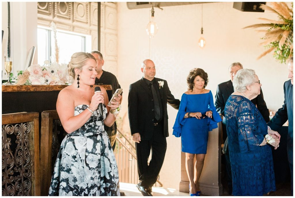 Maid of honor giving a speech at the wedding reception at Teak Red Bank.