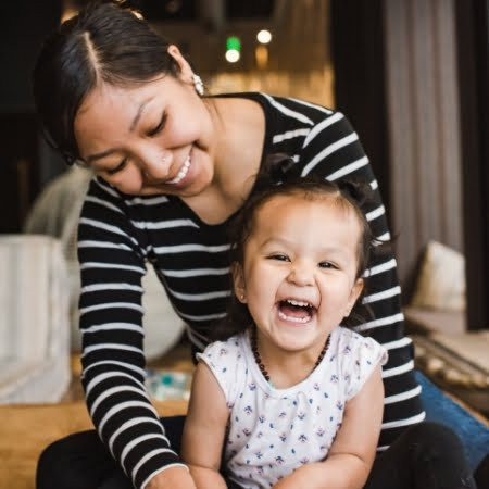 A mother and child with healthy food, representing the WIC program's focus on nutrition for families.
