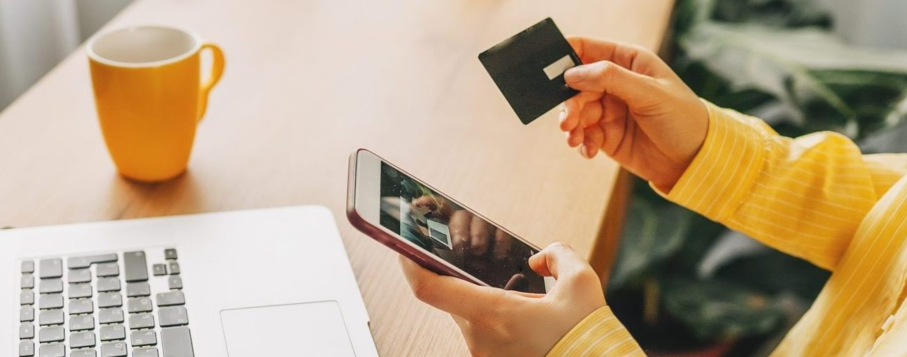 Discover debit card being swiped at a Walmart cashier for a cash deposit.