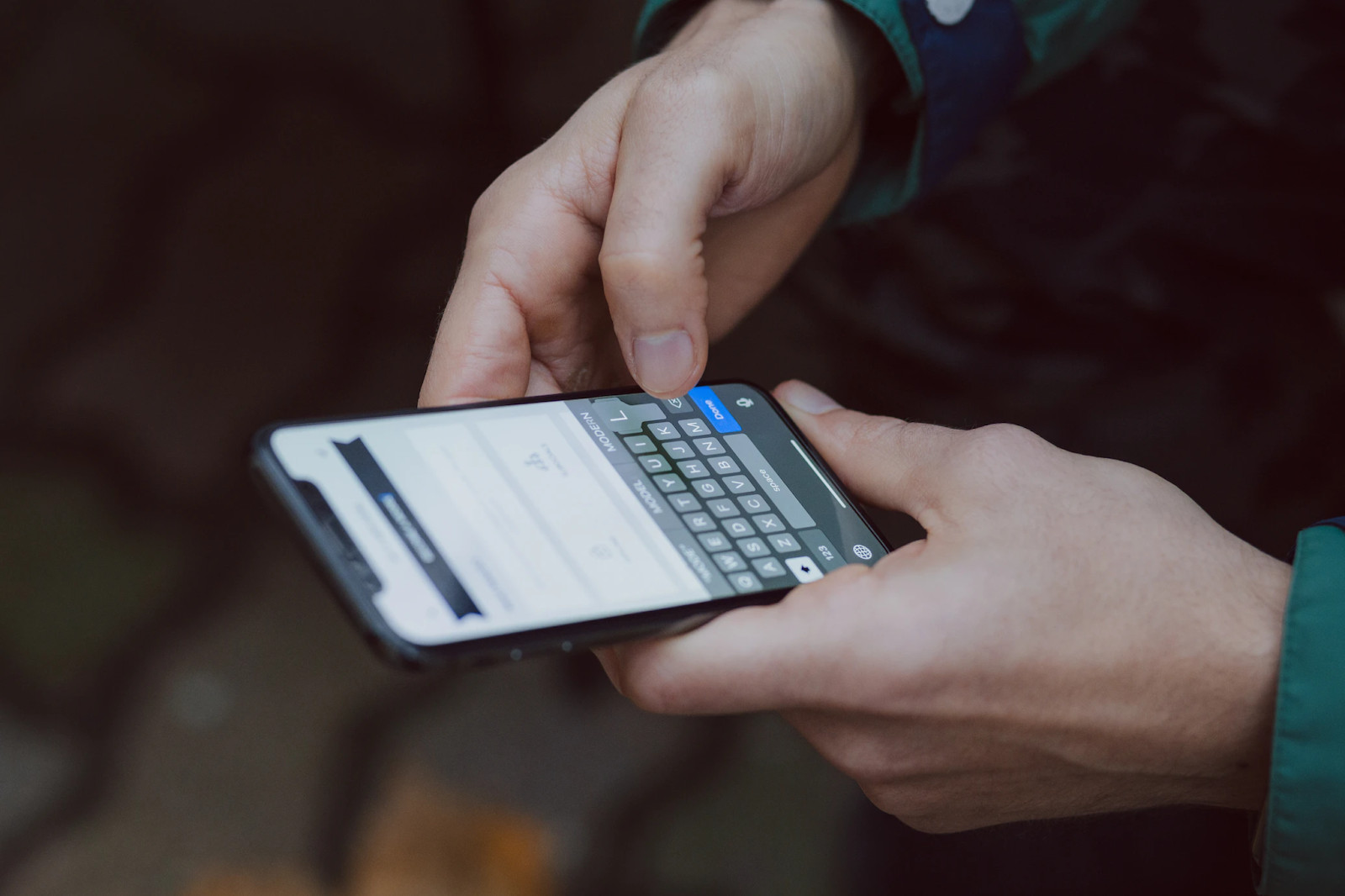 A person using a smartphone, highlighting mobile payment management