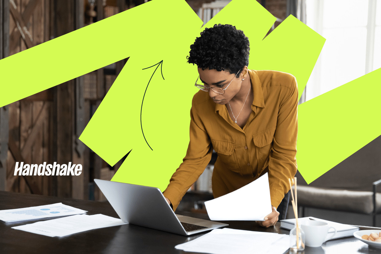 Office setting with a team of bank employees collaborating, highlighting teamwork and communication in banking careers.