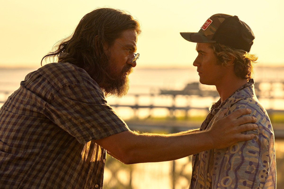 Charles Halford and Chase Stokes in Outer Banks, showcasing their complex father-son relationship